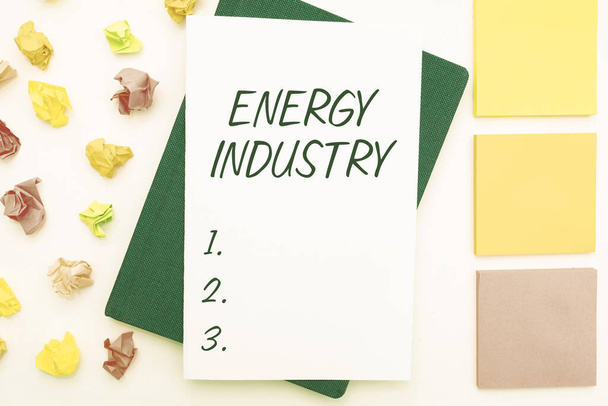 Text sign showing Energy Industry. Word Written on industries involved in the production and sale of energy Multiple Assorted Collection Office Stationery Photo Placed Over Table - Photo, Image