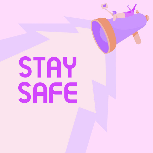 Conceptual caption Stay Safe. Business idea secure from threat of danger, harm or place to keep articles Man Drawing On Megaphone Producing Lighting Making Lovely Message. - Photo, Image
