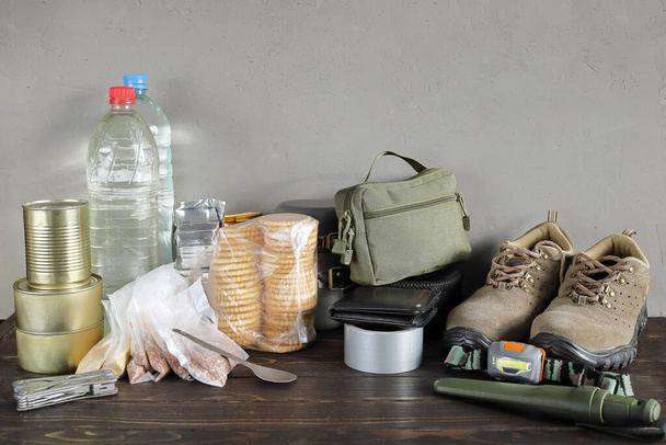 Set of long-term storage food and necessary objects for emergency situations and evacuation, with copy space - Photo, Image