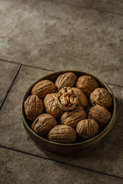 walnuts in a shell in a bowl. High quality photo - Φωτογραφία, εικόνα
