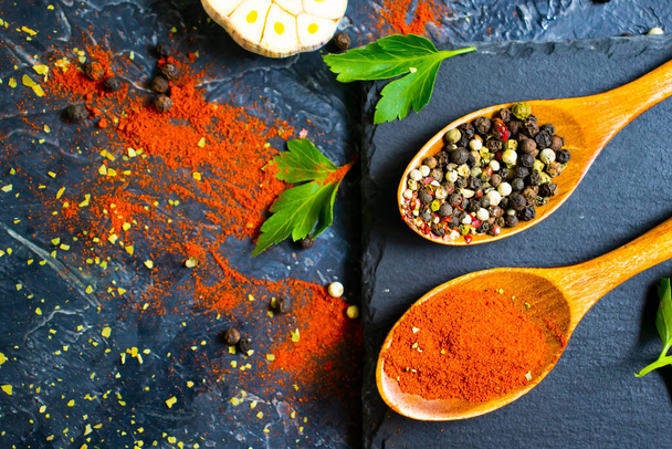 spice pepper in a spoon on a dark background - Photo, Image