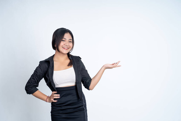 Young asian woman with hand gesture presenting something - Photo, image