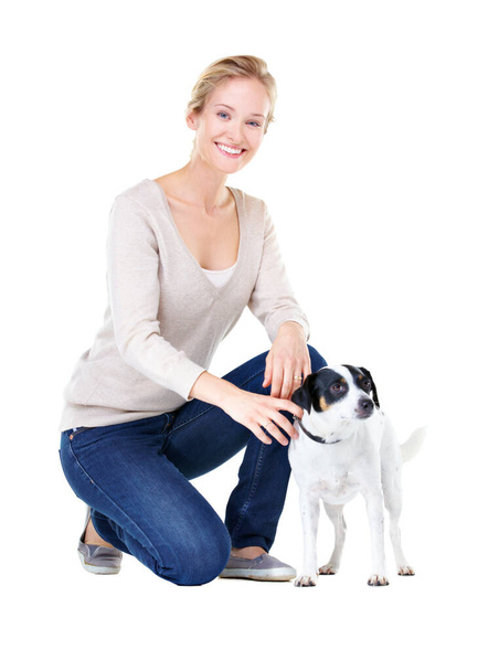 We take good care of each other. A gorgeous young woman kneeling next to her Jack Russell. - Photo, image