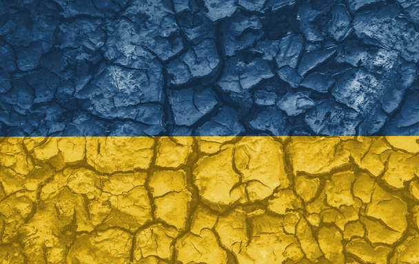 Ukrainian national flag pattern cracked earth, war concept - Fotoğraf, Görsel
