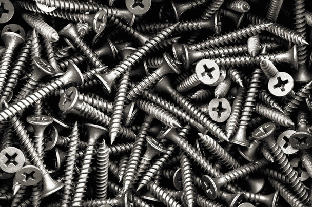 Closeup of steel screws many screws on box can be use as background. - Photo, Image