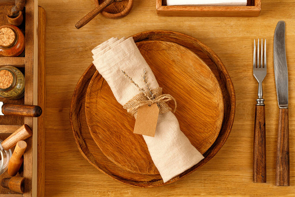 Nature Rustic Serving with a wooden plate, napkin, knife and forks. Wedding serving idea. Dinner time. - Foto, imagen