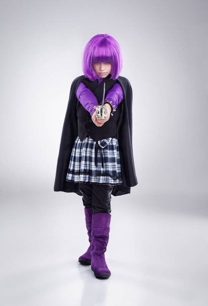Superhero in training. A studio shot of a confident little girl playing dress-up. - Foto, Imagen