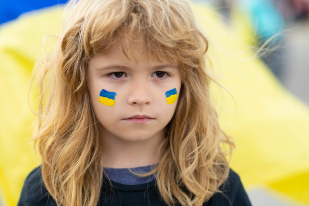 Ukraine flag on children cheeks. Human protest. - Foto, Imagem
