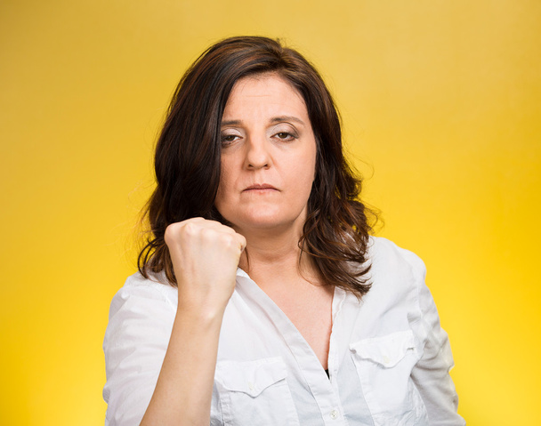 angry woman putting up fist warning - Valokuva, kuva