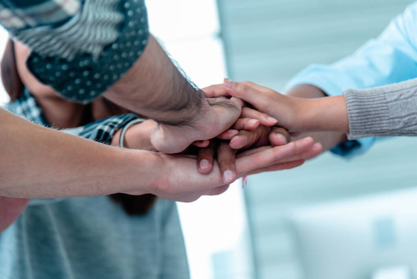 Group of diversity people fist bump holding hands together power of tag team. Teamwork Multiethnic people group working togetherness. Business people team holding hands successful. Business meeting - Foto, Imagen