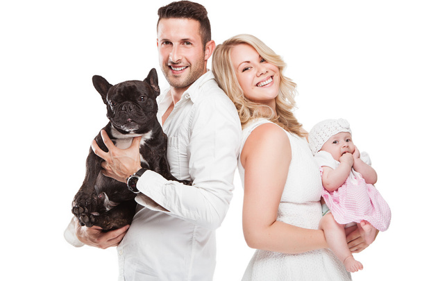 hermosa familia joven con pequeño bebé y perro
 - Foto, Imagen