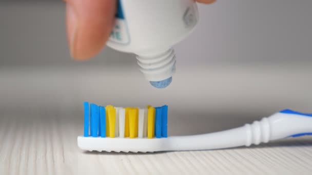 close up view of toothpaste with toothbrush - Footage, Video