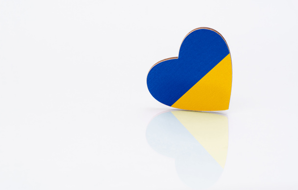 Flag of Ukraine in the shape of a heart on a white background. - Photo, Image