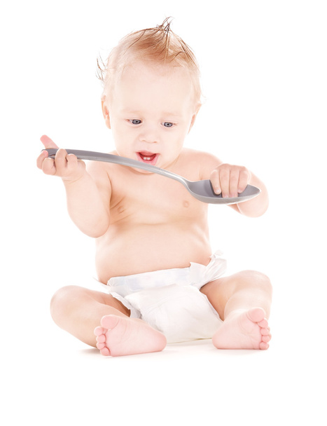 Baby boy with big spoon - Фото, изображение