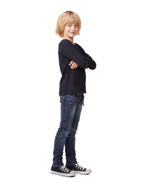 Shes the cool and confident. Portrait of a pretty little girl standing with arms crossed and smiling against a white background. - Valokuva, kuva