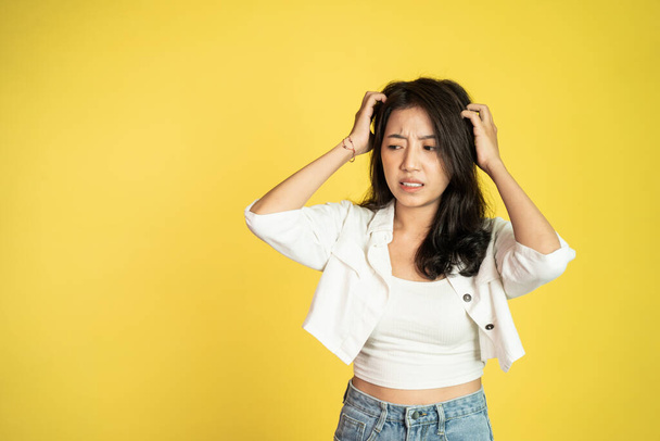 frustrated Asian young woman holding head with headache - Φωτογραφία, εικόνα