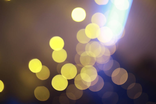 Abstract bokeh background. Golden bokeh circles on a dark blue background. Layer overlay. - Photo, Image