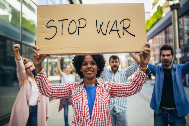 Anti-war protest. Demonstrators call for peace. Protest manifestation against attack or war. - Photo, Image