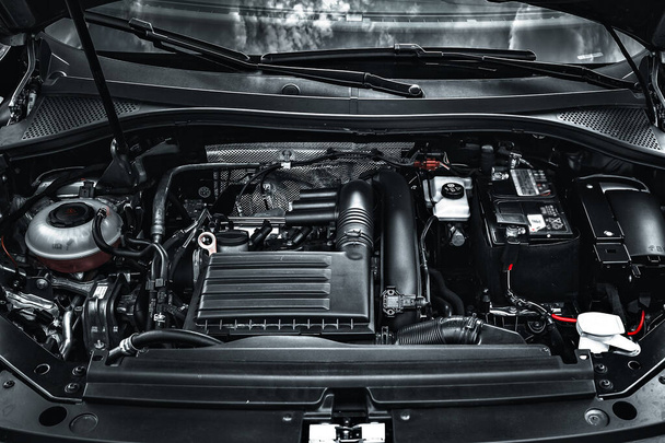 The car engine of a new car. View under the hood. Modern motor. - Photo, Image