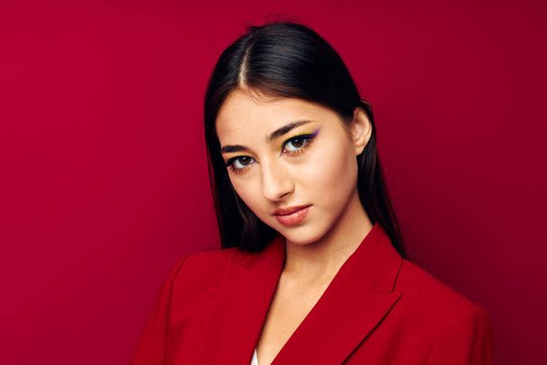 beautiful brunette bright makeup red jacket posing studio model unaltered - Foto, immagini