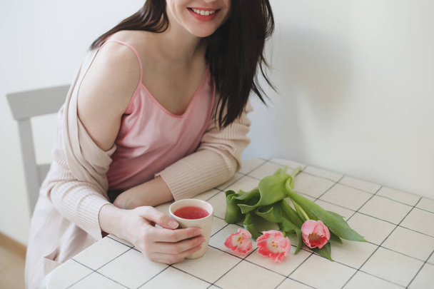 romantic tender portrait of a young woman with pink fresh tulips - Φωτογραφία, εικόνα