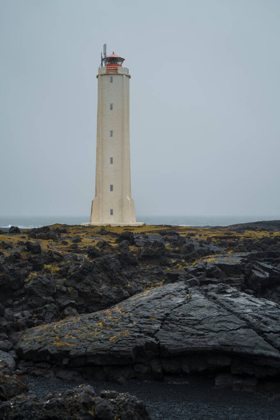 Malarrif lighthouse on the cliff near the ocean in Western Iceland. Snaefellsnes peninsula - Fotoğraf, Görsel