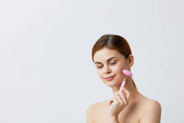 portrait of woman with  jade face massager  close-up Lifestyle. High quality photo - Foto, Imagem