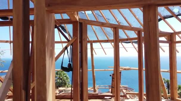 Inside a timber house under construction. Detailed photo of a wooden roof overlap construction - Footage, Video
