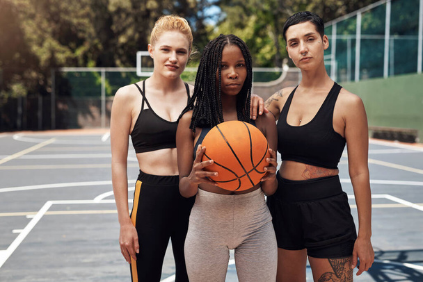 Winners dont wait for chances, they take them. Portrait of a group of sporty young women standing together on a sports court. - Fotó, kép