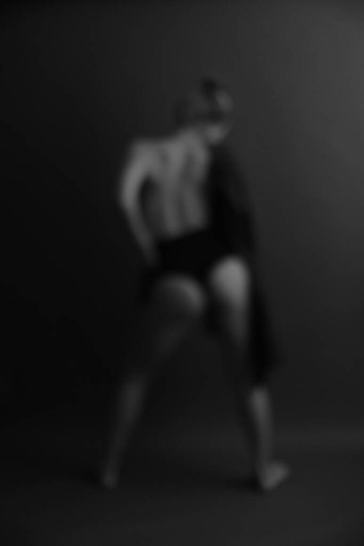 Blurred silhouette of a girl in underwear , soft focus gray background - Fotoğraf, Görsel
