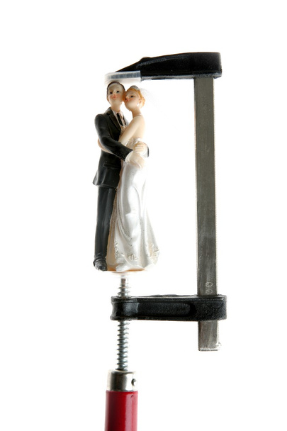 Wedding figurine under pressure - Foto, afbeelding