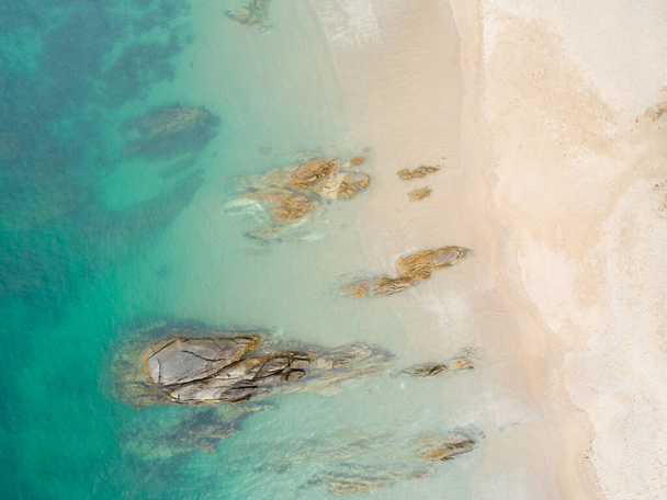 Aerial view sandy beach and crashing waves on sandy shore Beautiful tropical sea in the morning summer season image by Aerial view drone shot, high angle view Top down - Photo, Image