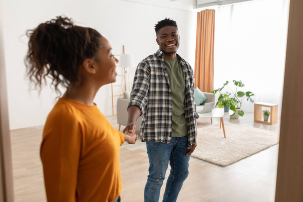Black Couple Entering Their House Holding Hands Standing Indoors - Photo, image