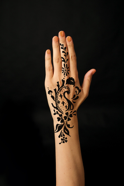 Hand with mehendi on black background - Photo, Image
