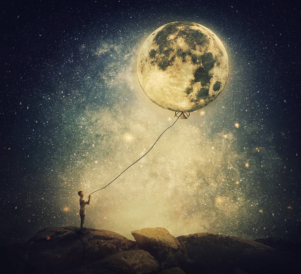 Surreal and inspirational scene with a person holding the full moon as a balloon with a rope. Dreamlike imaginary view over the night starry sky background - Photo, Image