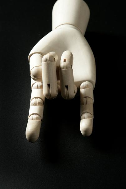Mannequin wooden hand, horns with fingers - Фото, изображение