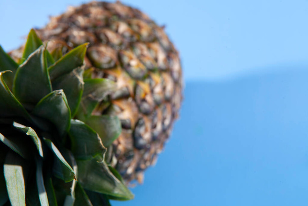 Pineapple on a blue background. close-up view  - 写真・画像