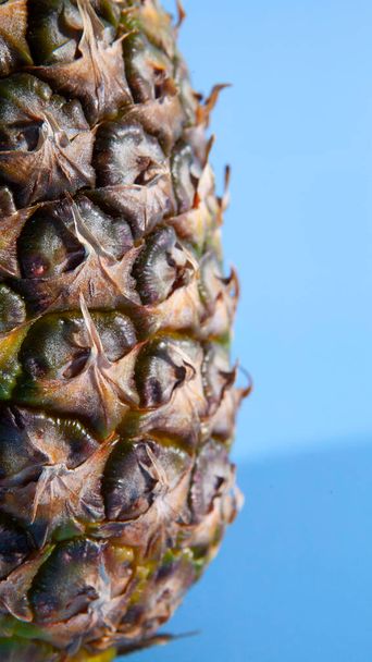 Pineapple on a blue background. close-up view  - Foto, imagen