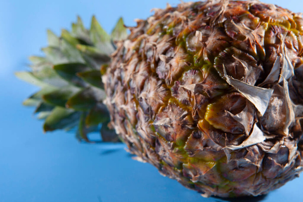 Pineapple on a blue background. close-up view  - Fotoğraf, Görsel