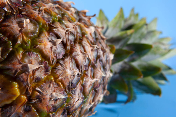 Pineapple on a blue background. close-up view  - Foto, imagen