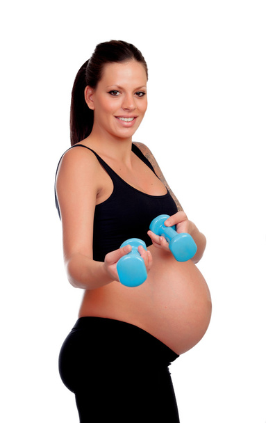 Brunette femme enceinte formation avec des haltères
 - Photo, image