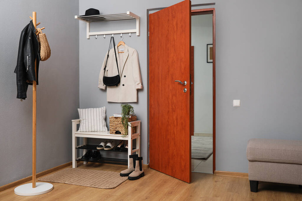 Modern hallway interior with shoe rack and wooden coat stand - Foto, immagini