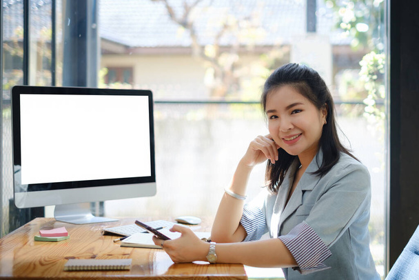 Business Finance and Accounting Concept. Business woman using cell phone at office. - Photo, Image
