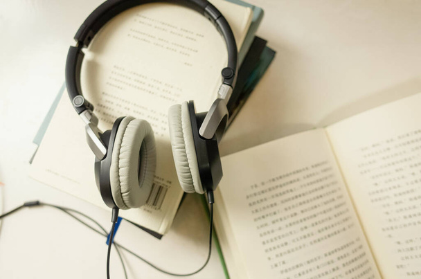 headphones with books, close up - Valokuva, kuva