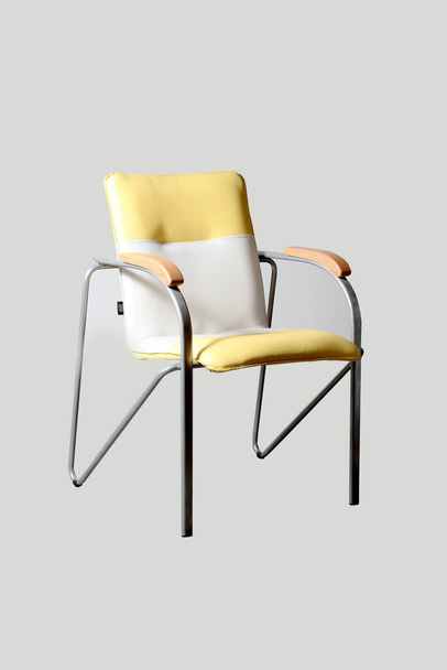 Soft yellow semi-chair on wooden legs - Фото, зображення