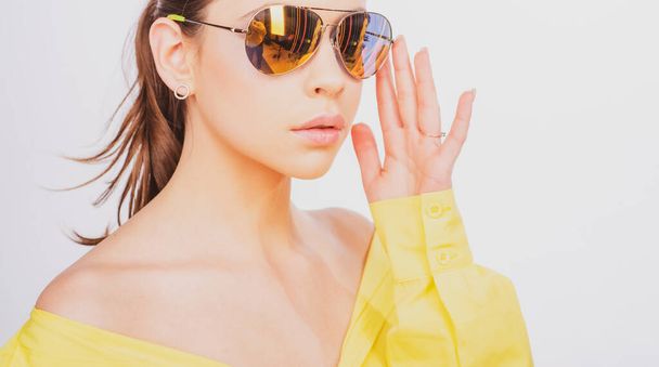Closeup sunglasses woman. Vogue trend fashion. Girl in summer sunglasses. - Фото, изображение