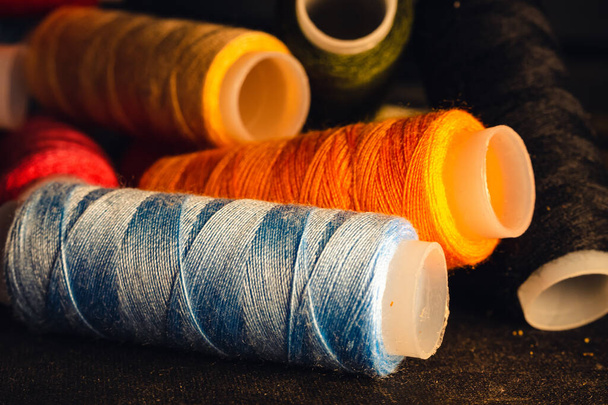 colorful threads on a black background - Photo, Image
