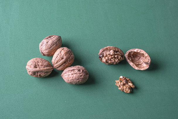 walnuts on a blue background. top view. - Zdjęcie, obraz