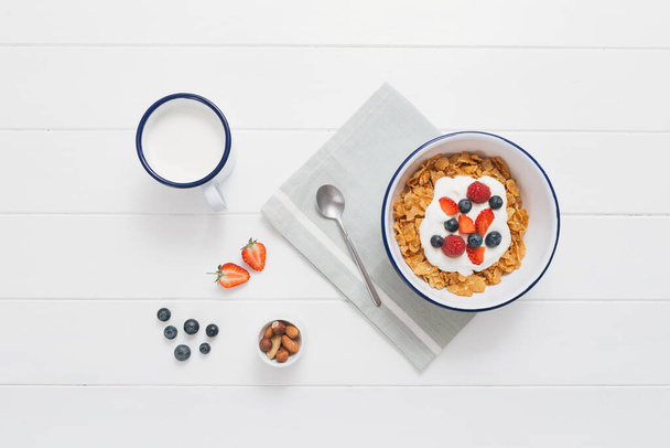 breakfast with granola and coffee, muesli and milk, top view - Foto, Bild