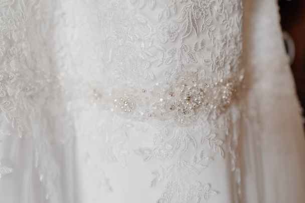 Wedding dress on a hanger - Fotoğraf, Görsel